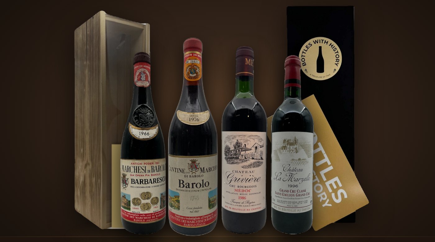 Vins millésimés de 1966, 1976, 1986 et 1996 devant des coffrets cadeaux Bottles With History en bois et noir